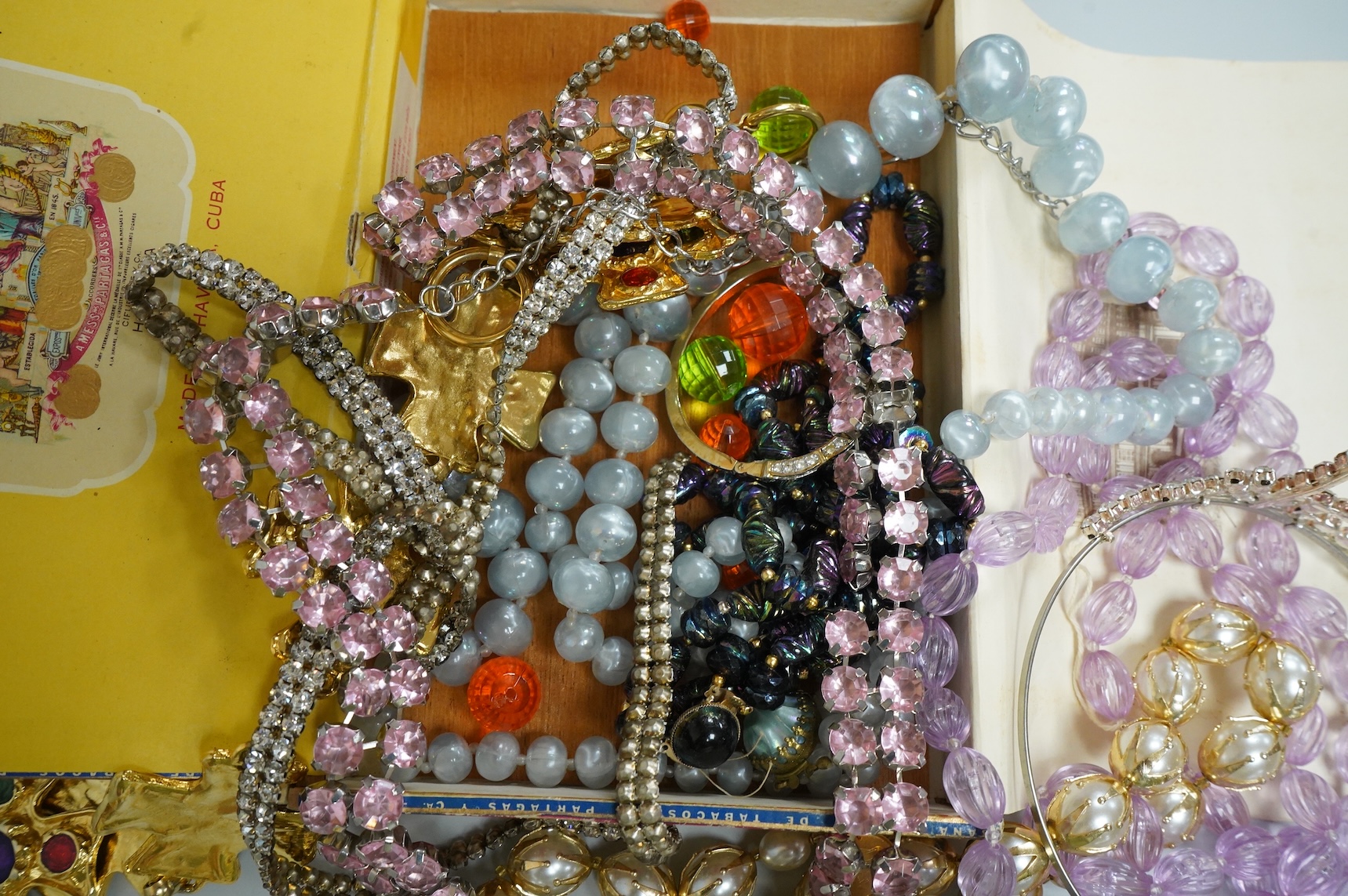 A group of assorted costume jewellery, glass beads etc.